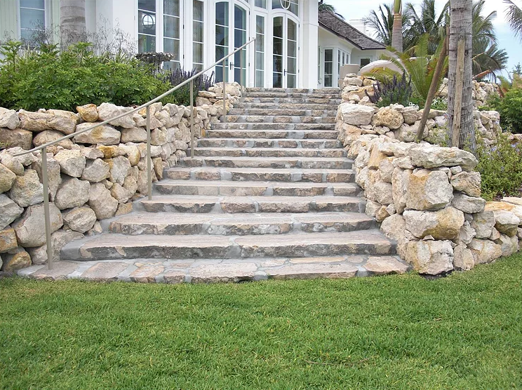 STAIRCASE WITH BOULDER WALL